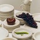 A collection of Hay Barro tableware in off-white.