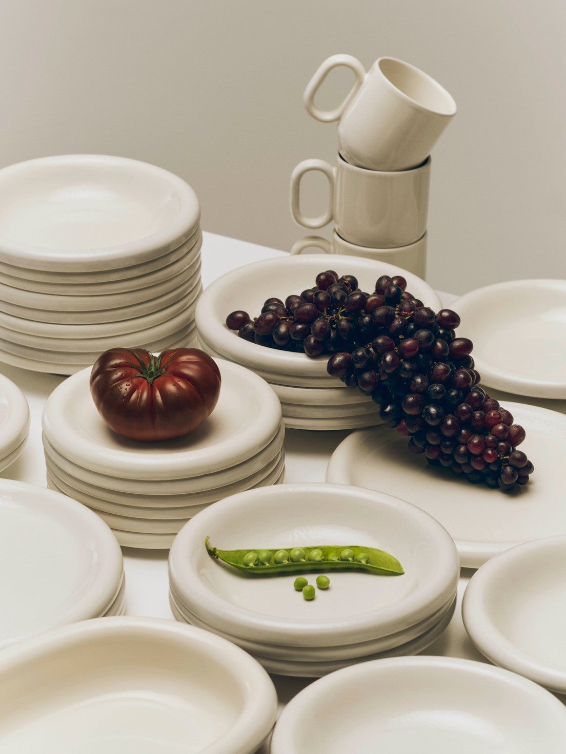 A collection of Hay Barro tableware in off-white.