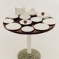 Hay Barro tableware in off-white on a side table. 