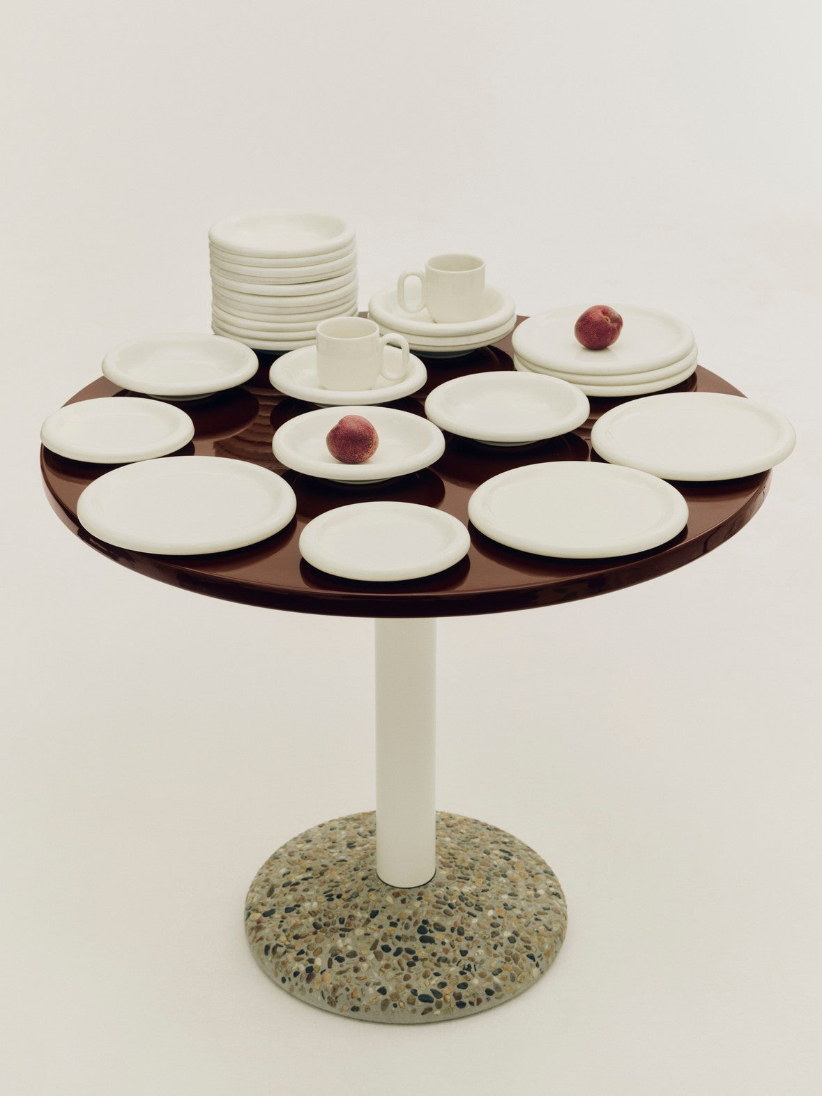 Hay Barro tableware in off-white on a side table. 
