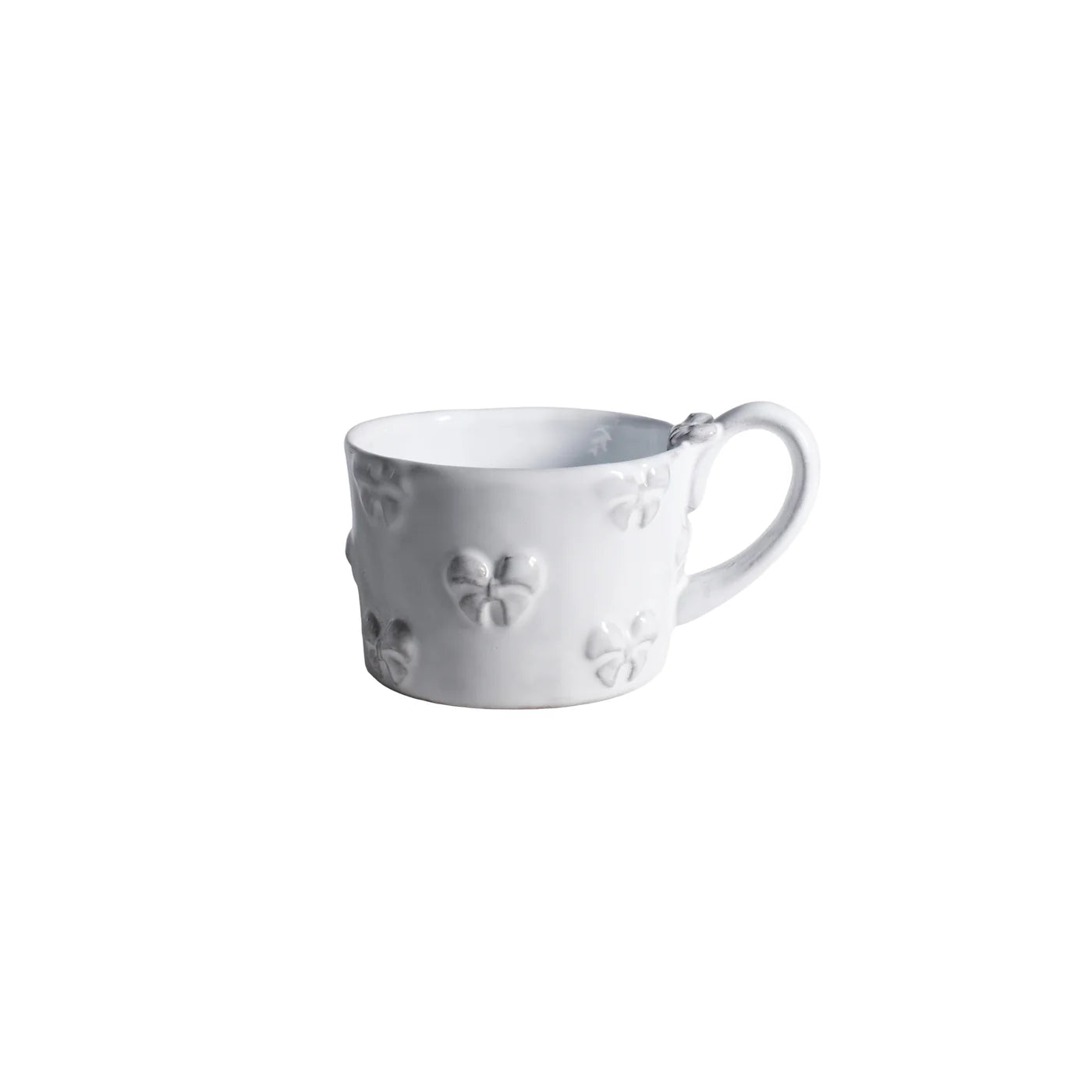Carron Paris ceramic mug featuring delicate embossed small bows, handcrafted in France for coffee and tea.