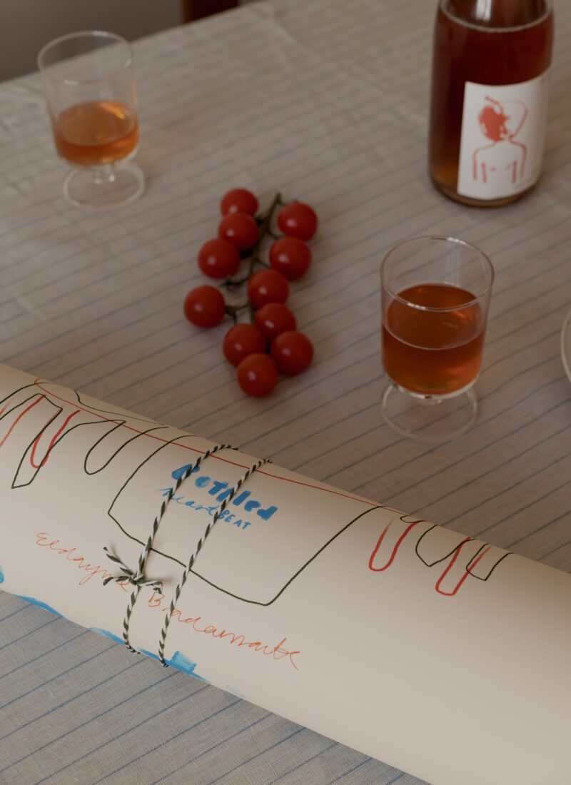 A closeup shot of the art print Poetica by Das Rotes Rabbit exclusively created for The Poster Club, wrapped up.