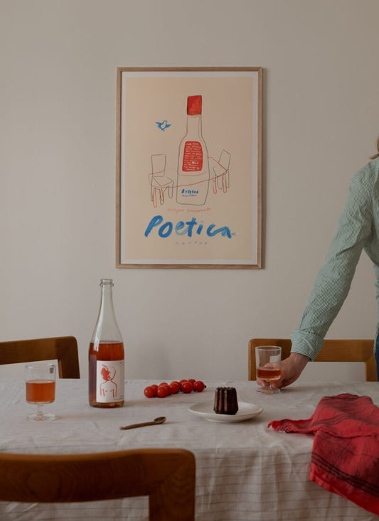 A lifestyle photo of the rrt print Poetica by Das Rotes Rabbit exclusively created for The Poster Club, in a light wooden frame.