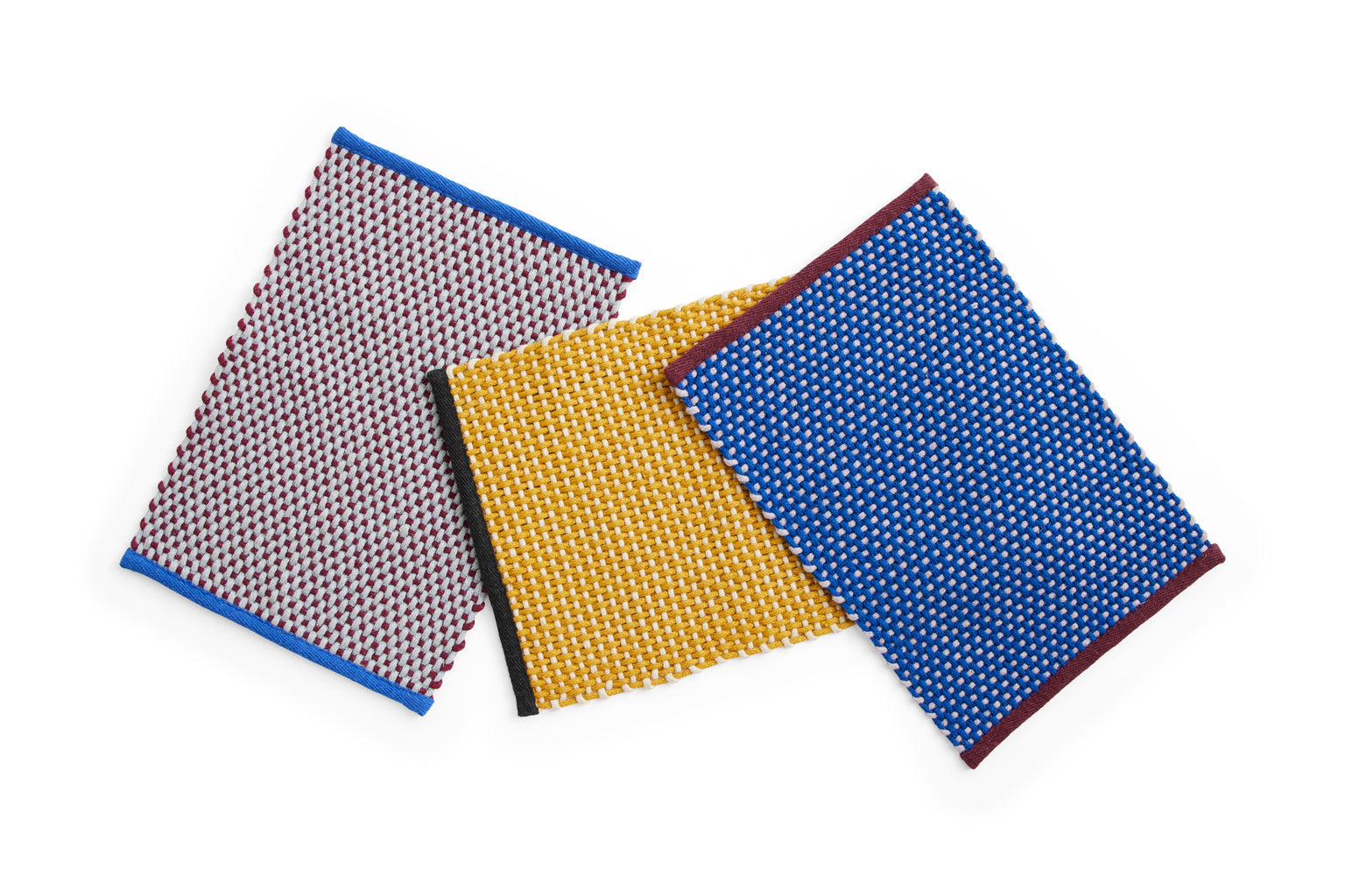 A pack shot of the Hay door mats, available in 3 colours.