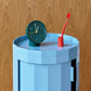 HAY Tann toothbrush red in toothbrush holder on a blue side table.