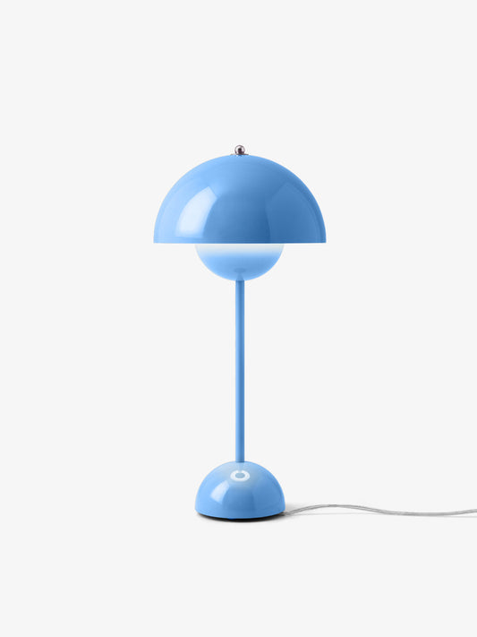 A pack shot of &Tradition Swim Blue Flowerpot VP3 Table Lamp by Verner Panton with light on
