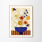 Art print Colourful Bunch in Blue Vase by Frankie Penwill, exclusively created for The Poster Club, in a light wooden frame.