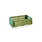 Side-angle view of the small HAY Colour Crate in a two-tone olive and dark mint green, showcasing its stackable, ventilated industrial design made from recycled plastic.