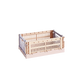 Side-angle view of the small HAY Colour Crate in a soft powder hue, showcasing its stackable, ventilated industrial design made from recycled plastic.