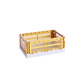 Side-angle view of the small HAY Colour Crate Mix in a vibrant golden yellow, showcasing its stackable, ventilated industrial design made from recycled plastic.