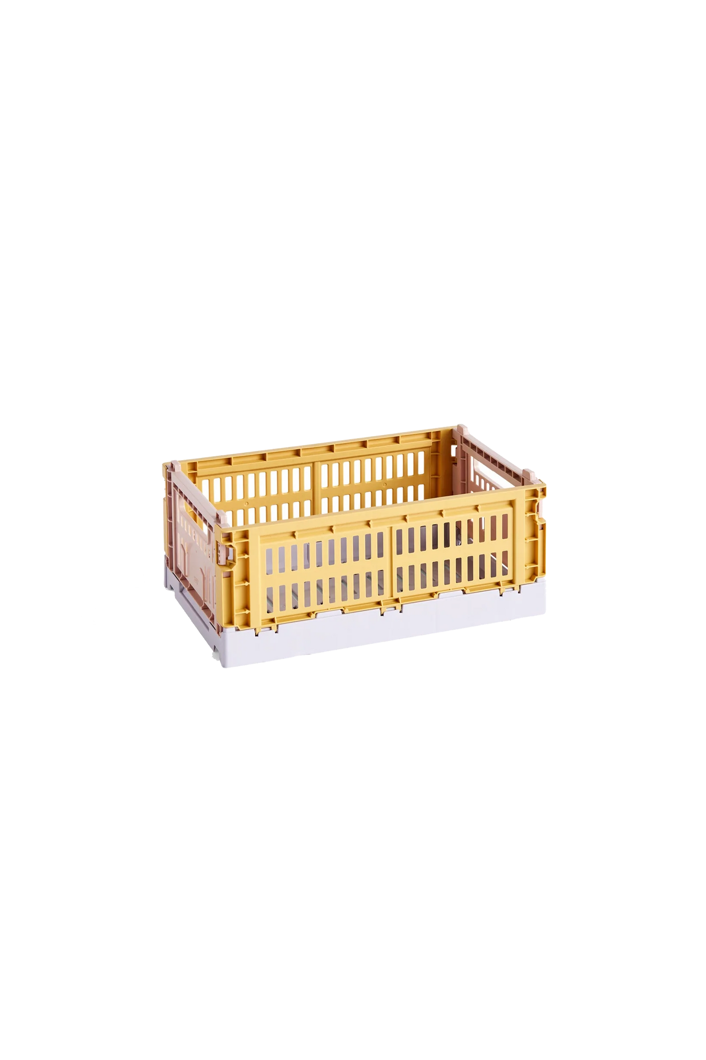 Side-angle view of the small HAY Colour Crate Mix in a vibrant golden yellow, showcasing its stackable, ventilated industrial design made from recycled plastic.