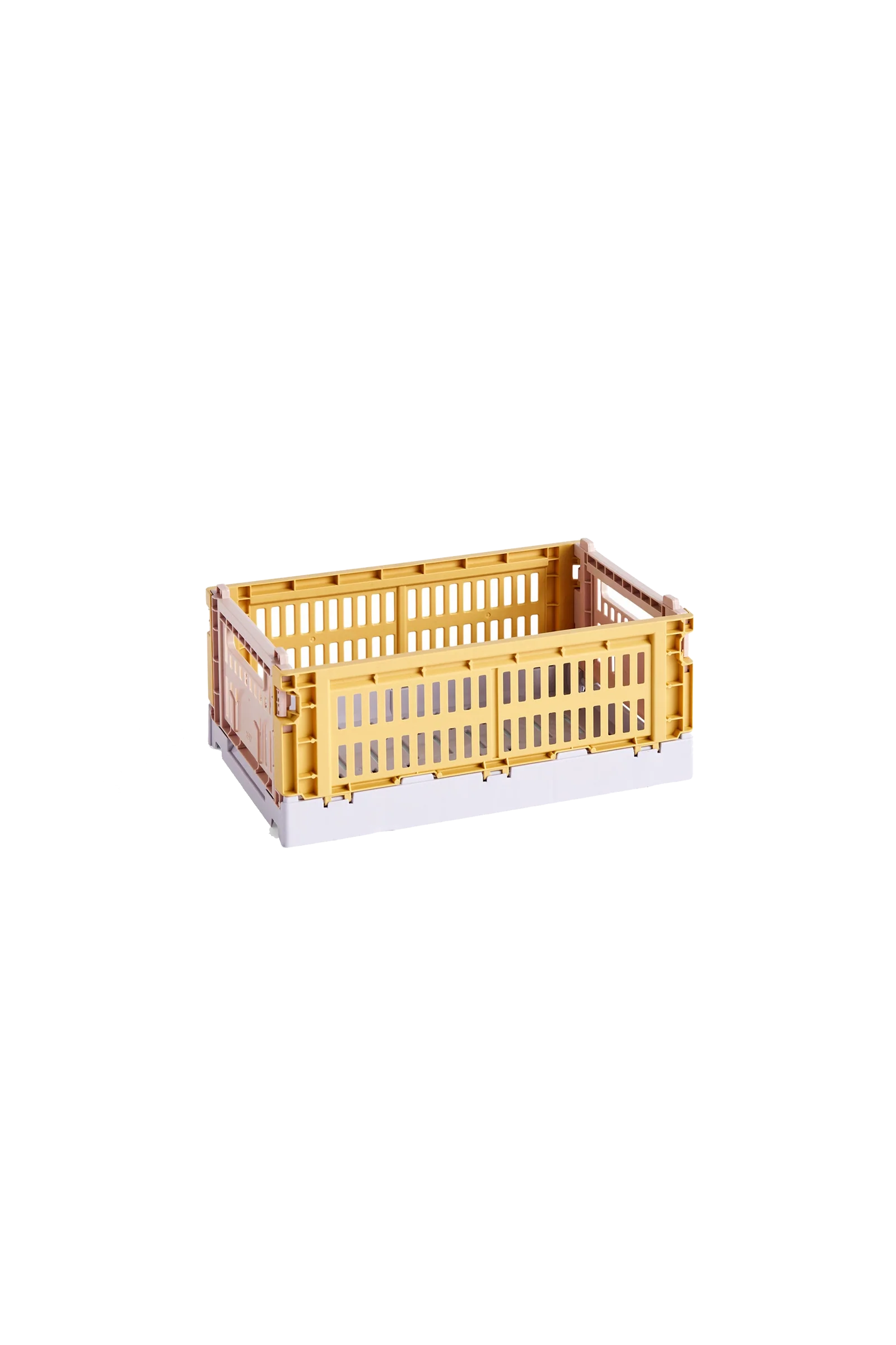 Side-angle view of the small HAY Colour Crate Mix in a vibrant golden yellow, showcasing its stackable, ventilated industrial design made from recycled plastic.