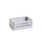 Side-angle view of the small HAY Colour Crate in a soft lavender hue, showcasing its stackable, ventilated industrial design made from recycled plastic.