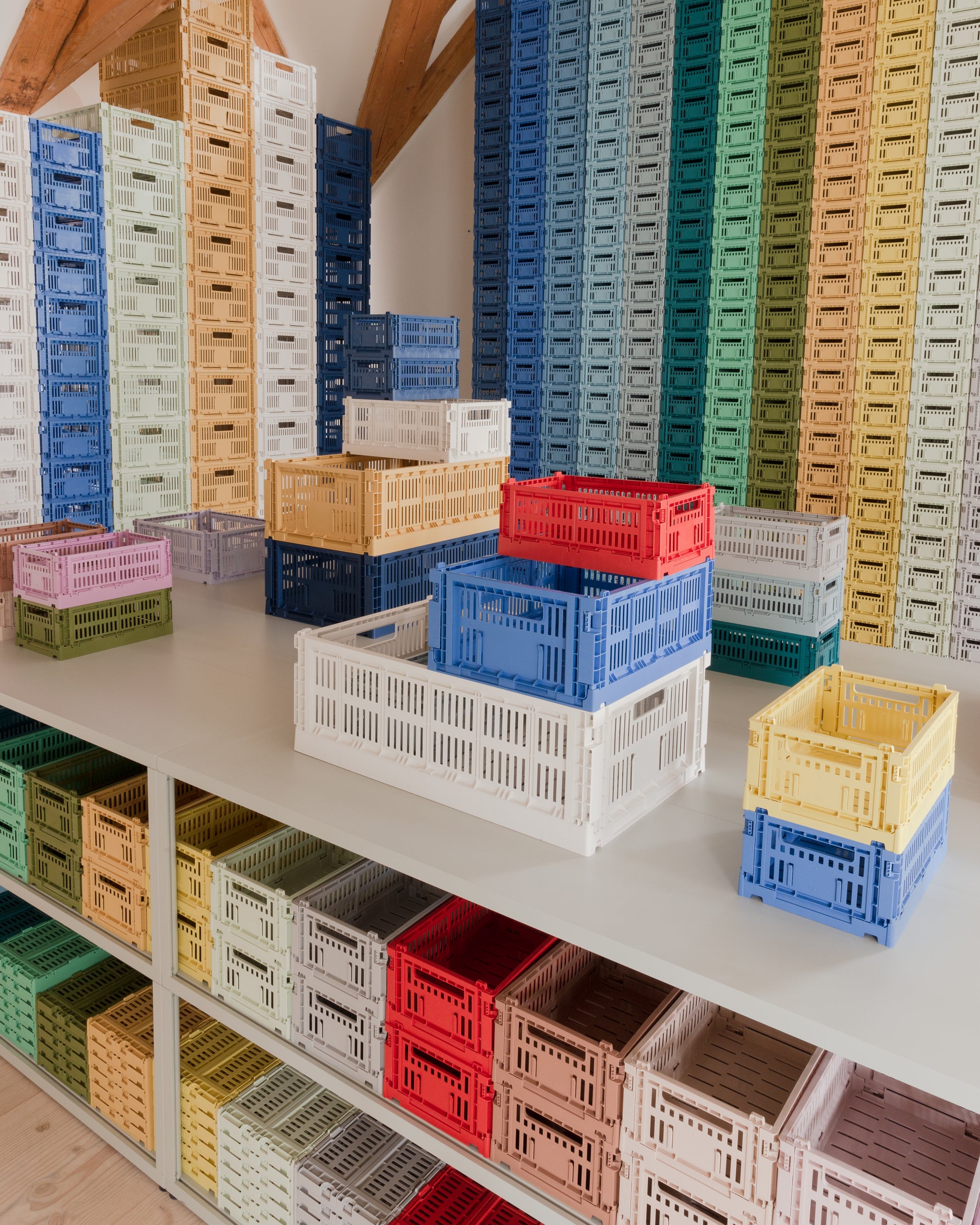 Stacked Hay Colour Crate organisers in a shop. 