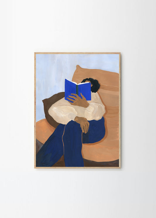 A artwork of a person reading a book on a couch, called The Togo by Hanna Peterson.