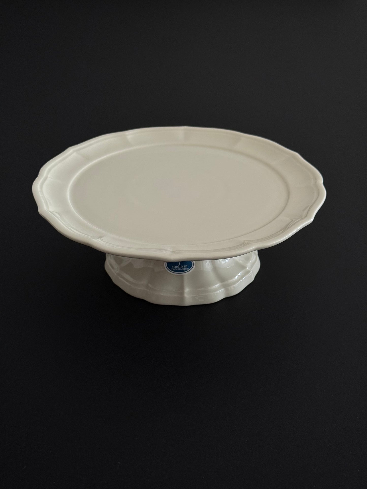 A photo of Studio M' Parler Compote on a black dining table. 