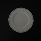 Tuxton Charleston round dinner plate in American White with embossed scalloped edges.