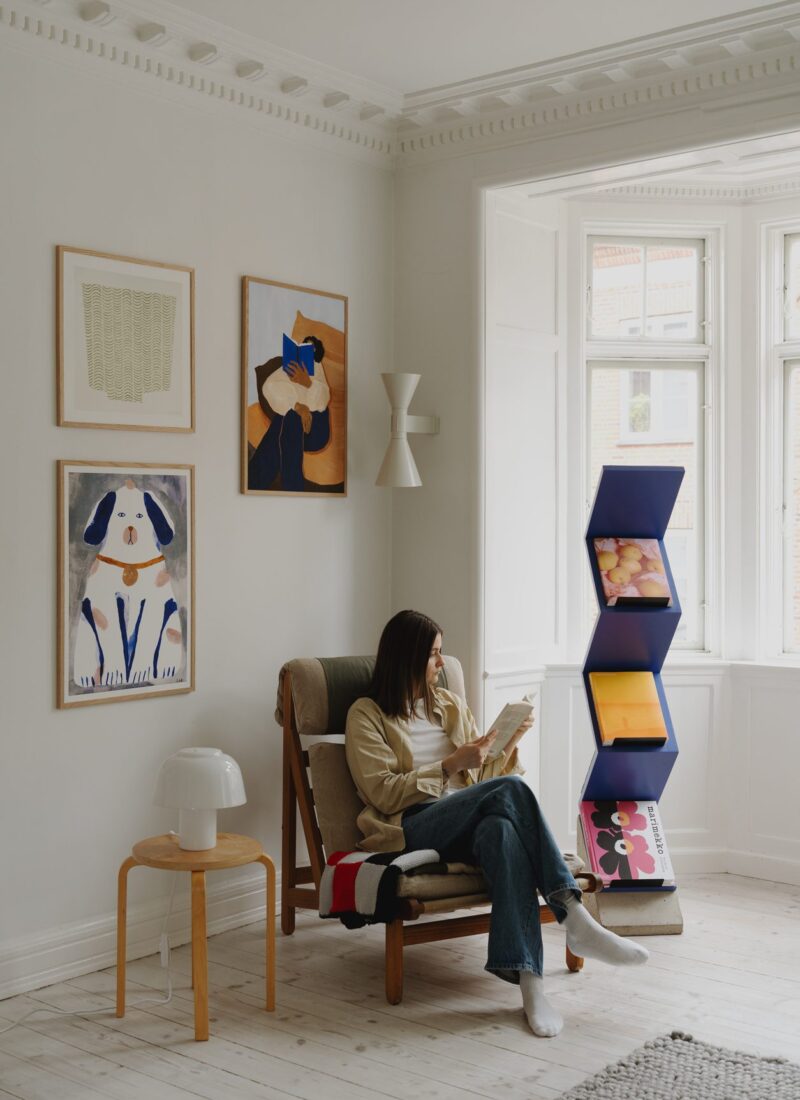 A lifestyle photo of an art wall including The Togo by Hanna Peterson, in a Scandinavian interior.