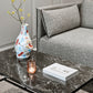 The HAY Jessica Hans stoneware vase in the Miro colorway, on a marble coffee table.