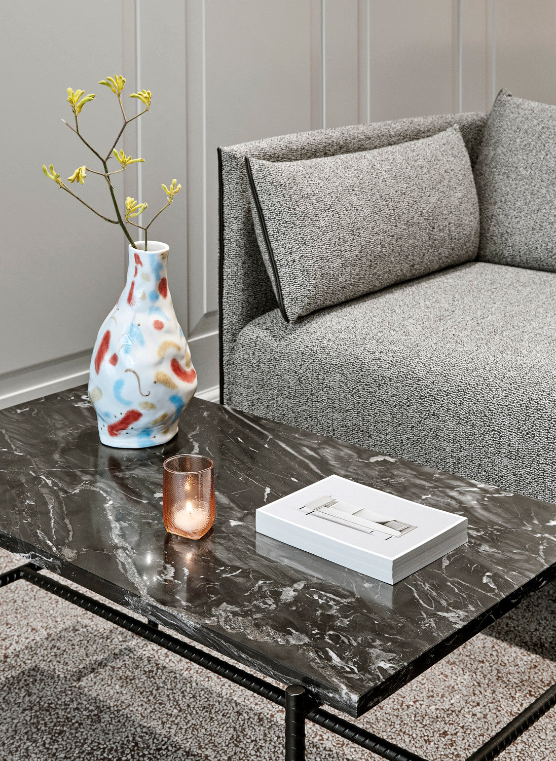 The HAY Jessica Hans stoneware vase in the Miro colorway, on a marble coffee table.