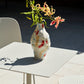 A lifestyle shot of the HAY Jessica Hans stoneware vase in the Miro colourway.