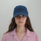 Front of Woman wearing HÔTEL827 Sun Kissed blue baseball cap in casual street style