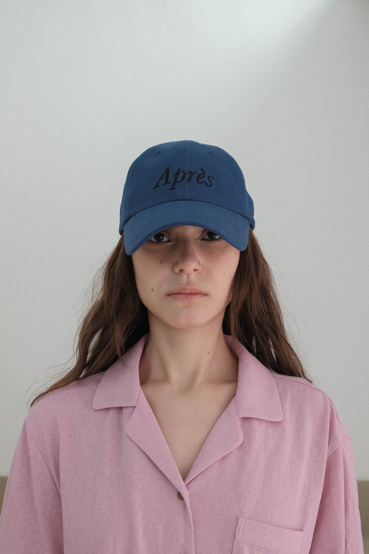 Front of Woman wearing HÔTEL827 Sun Kissed blue baseball cap in casual street style