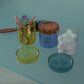 HÔTEL827 glass storage jars on vanity holding cotton pads and accessories