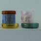 HÔTEL827 pink glass storage jar on vanity holding cotton pads and accessories