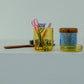 HÔTEL827 blue glass storage jar on vanity table holding cotton pads and accessories