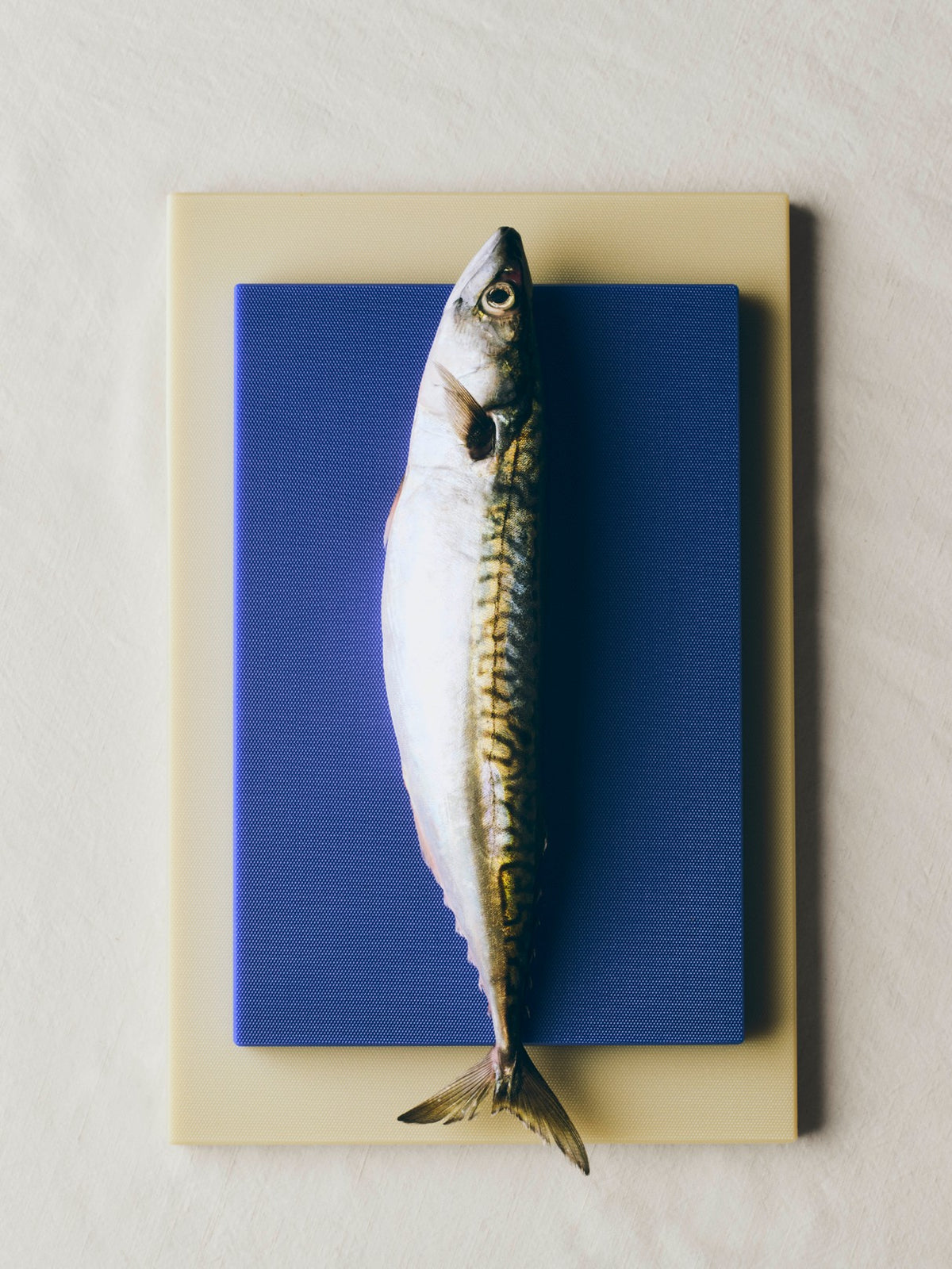 Stacked Hay slice chopping boards with fish. 