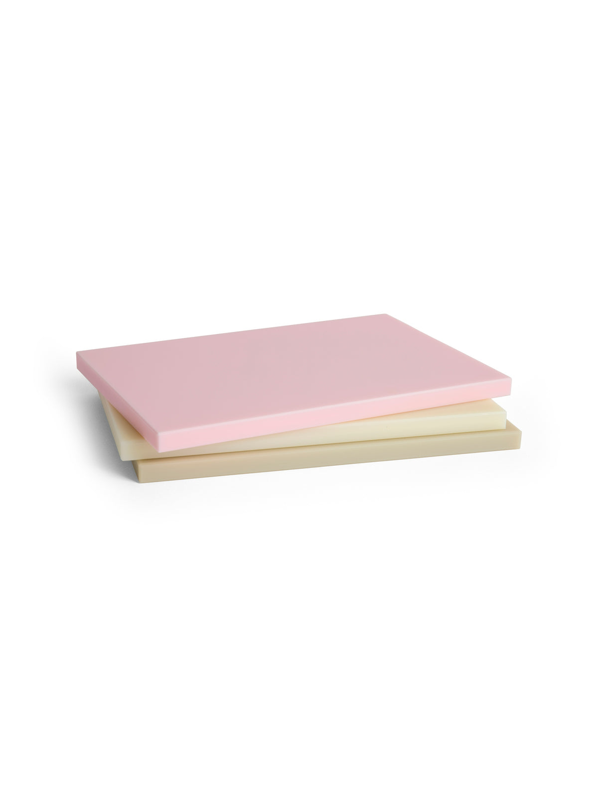 Pack shot of HAY slice cutting board large in three colours.