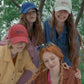 Four young women wearing HÔTEL827 Sun Kissed baseball cap in three colours.