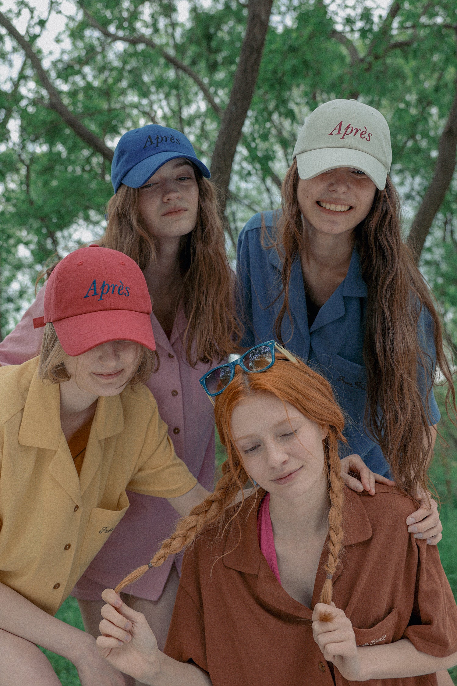 Four young women wearing HÔTEL827 Sun Kissed baseball cap in three colours.