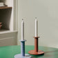 HAY Barro light blue candleholder with lit taper candle on modern dining table