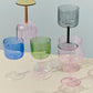 A shot of set of two HAY Tint Wine Glasses, available in different colours.