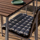 Hay Barro Plate 18cm in Green on a wooden outdoor table. 