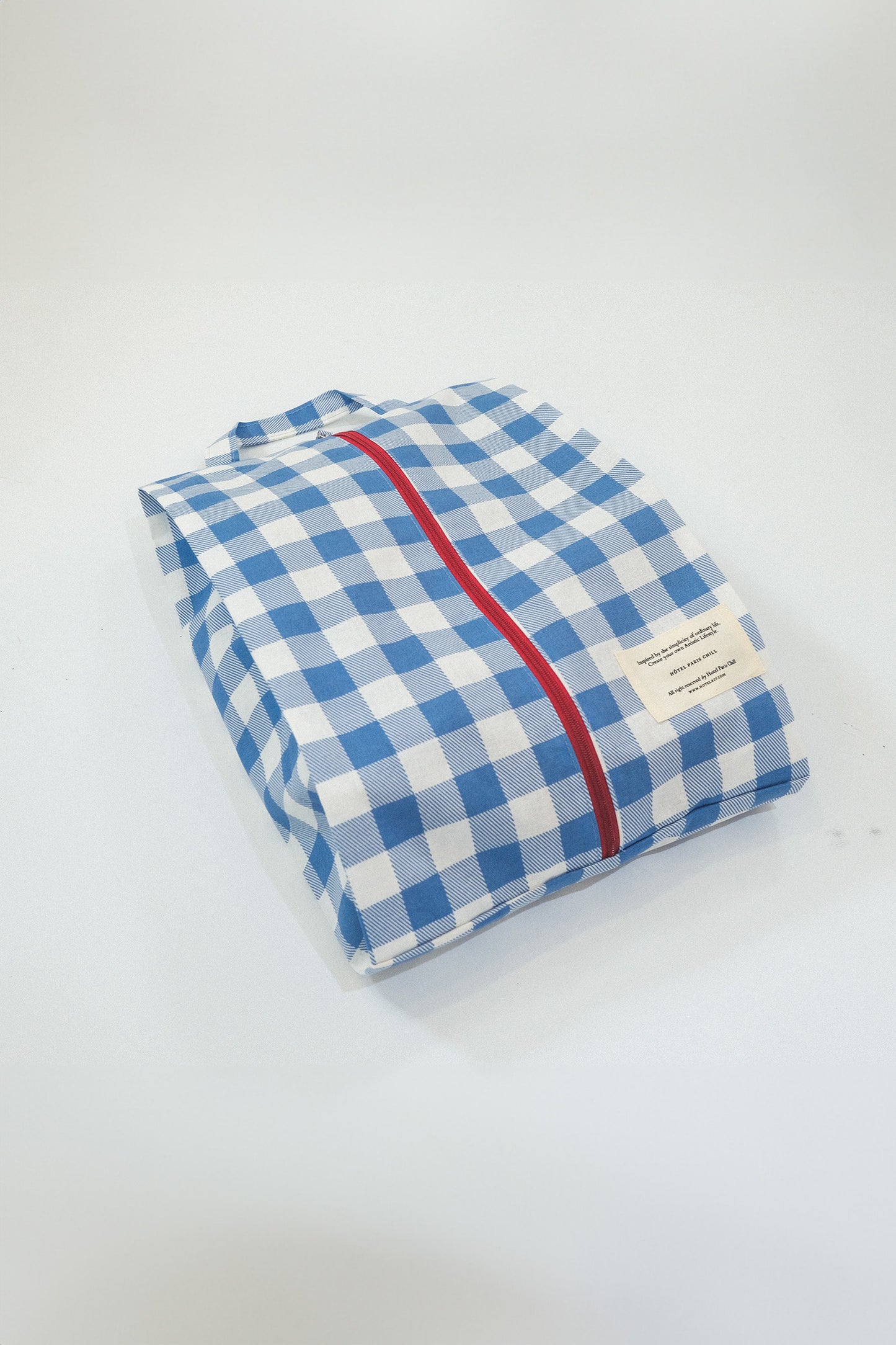 A side view of medium Hotel827 cotton travel pouch in Ripples. 