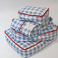 A stack of Hotel827 cotton travel pouch in Ripples, in different sizes. 