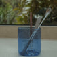 HÔTEL827 blue glass storage jar on kitchen bench-top storing cutlery. 
