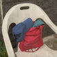 HÔTEL827 Sun Kissed blue baseball cap on top of Hotel827 sun kissed bag in red. 