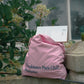 HÔTEL827 Sun Kissed pink canvas tote bag at outdoor. 