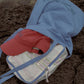 HÔTEL827 Sun Kissed baseball cap in chilli in Hotel827 blue bag.