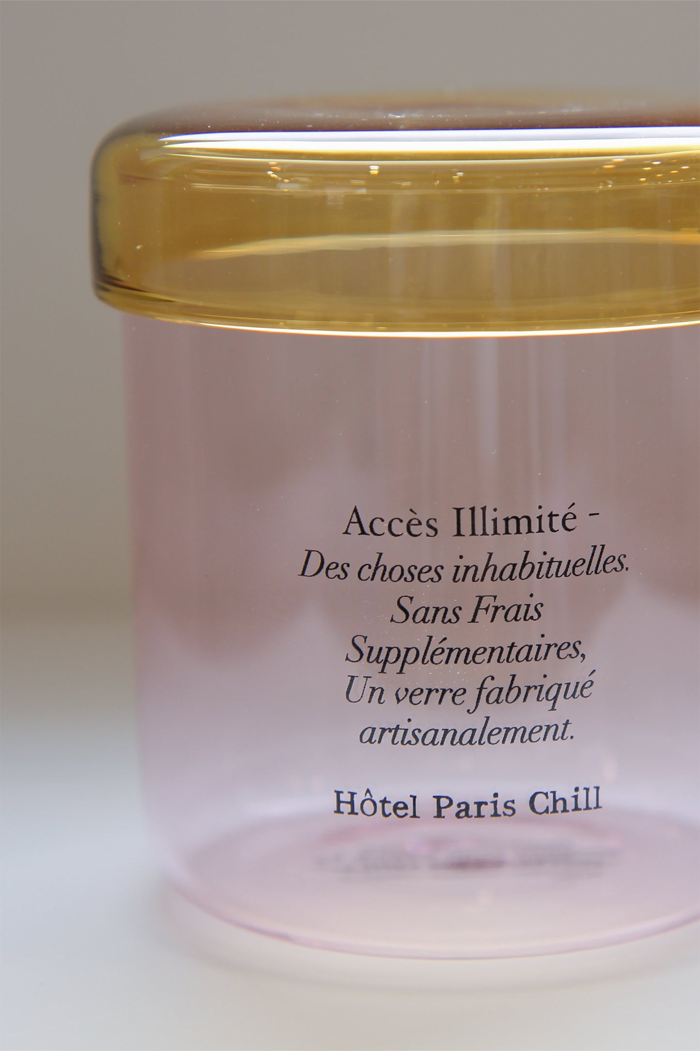 Close-up of HÔTEL827 pink glass storage jar