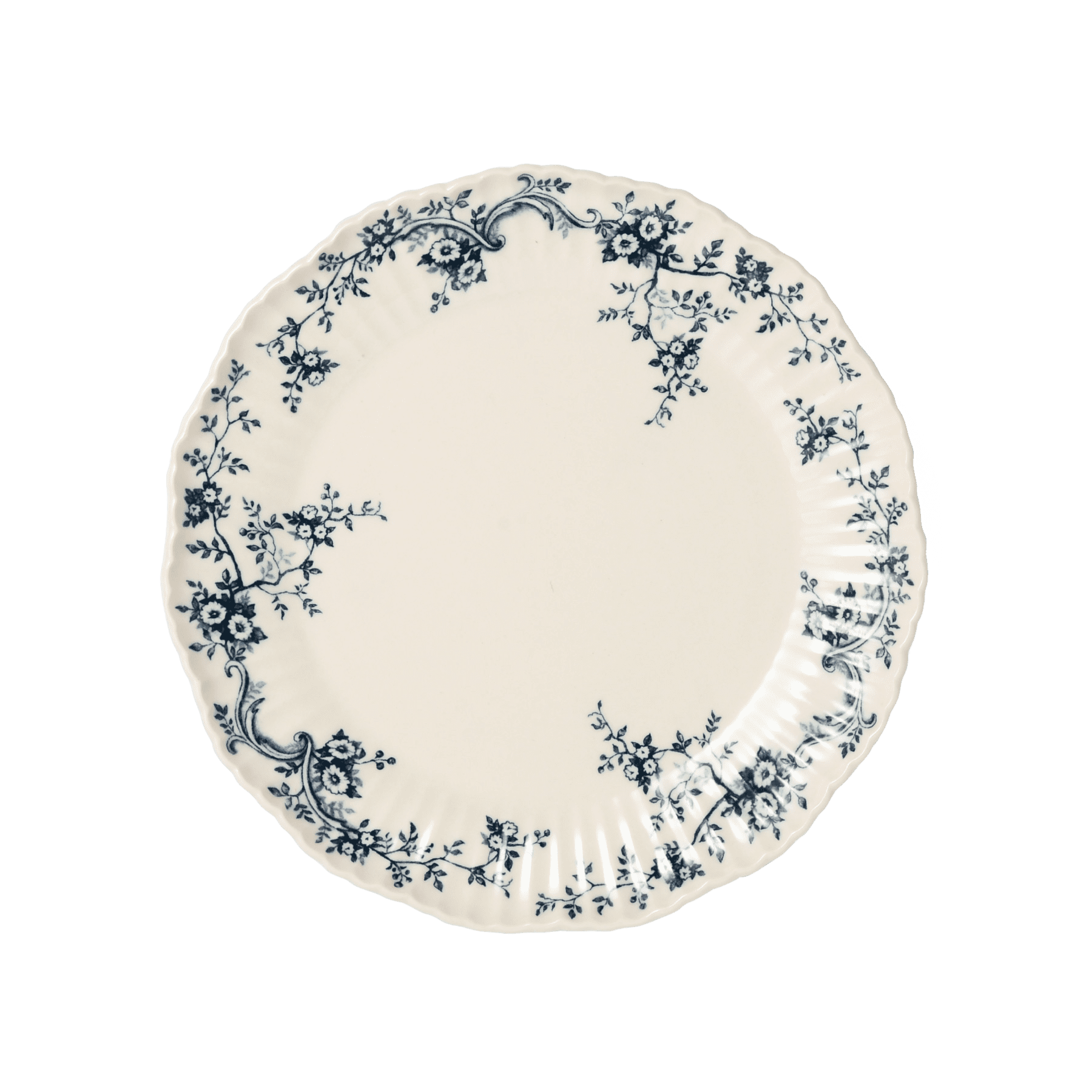 A pack shot of Studio M' Audrey 200 Plate in indigo porcelain, featuring a scalloped lace-like rim and an English garden-inspired floral relief pattern.