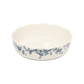 A pack shot of Studio M' Audrey Cake Pan in indigo colour, featuring a scalloped lace-like rim and an English garden-inspired floral relief pattern.