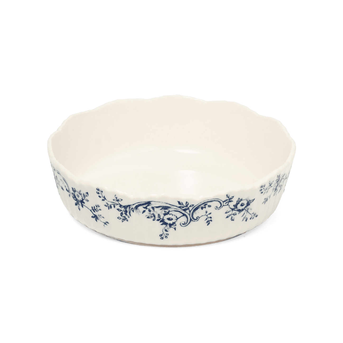 A pack shot of Studio M' Audrey Cake Pan in indigo colour, featuring a scalloped lace-like rim and an English garden-inspired floral relief pattern.
