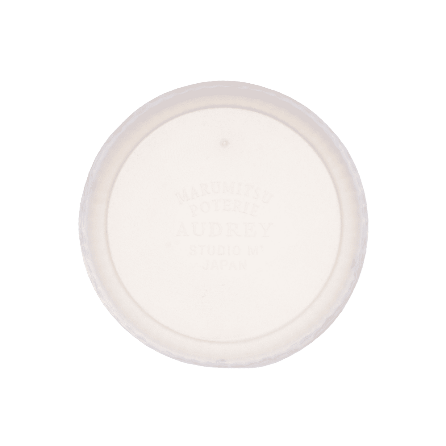 The base of Studio M' Audrey Cake Pan in porcelain, featuring a scalloped lace-like rim and an English garden-inspired floral relief pattern.