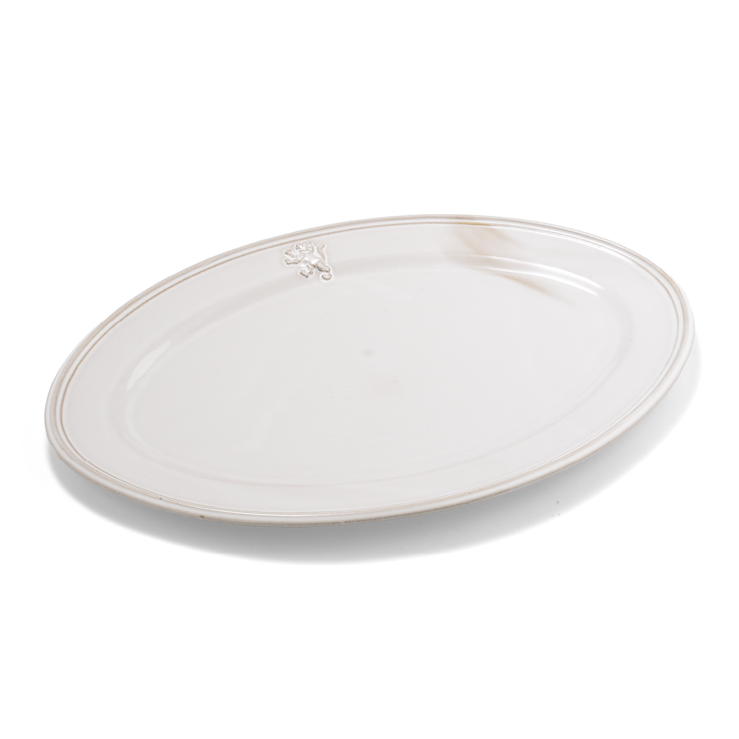 A pack shot of Studio M' Malta Oval Plate 28cm in a stunning white glaze from a side angle. 