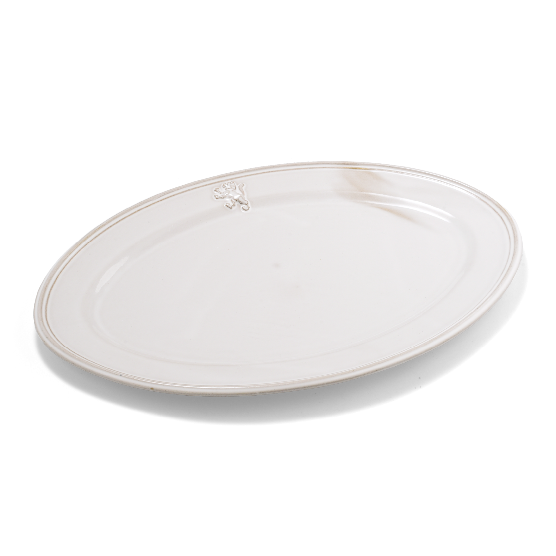 A pack shot of Studio M' Malta Oval Plate 28cm in a stunning white glaze from a side angle. 